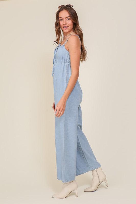 DENIM BLUE SLEEVELESS JUMPSUIT WITH SELF FRONT TIE - Lucianne Boutique