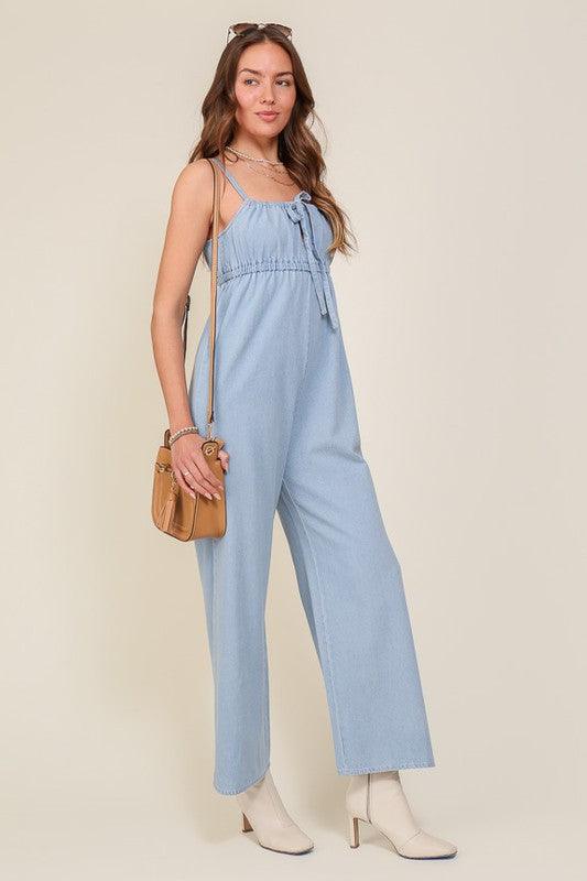 DENIM BLUE SLEEVELESS JUMPSUIT WITH SELF FRONT TIE - Lucianne Boutique